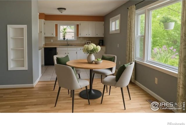 117 Welch Ave, Berthoud, CO 80513 - dining space featuring light wood-style floors and baseboards
