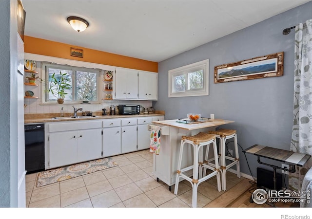 117 Welch Ave, Berthoud, CO 80513 - kitchen featuring dishwasher, a sink, open shelves, and healthy amount of natural light