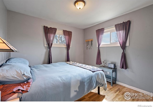117 Welch Ave, Berthoud, CO 80513 - bedroom with wood finished floors and baseboards