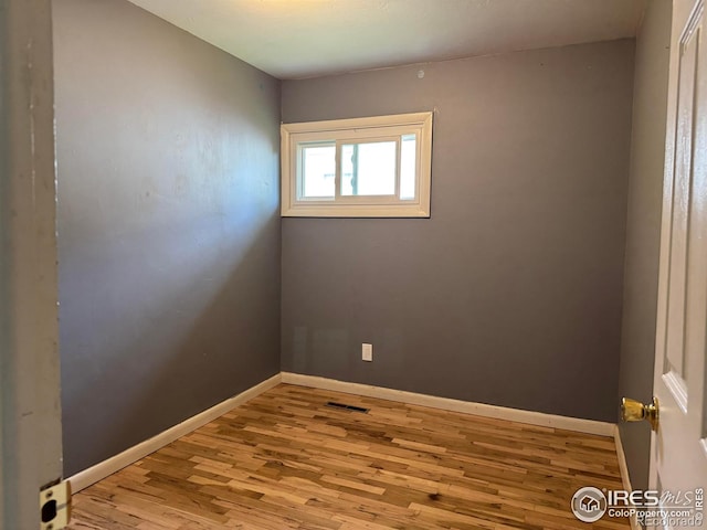 117 Welch Ave, Berthoud, CO 80513 - spare room featuring wood finished floors and baseboards