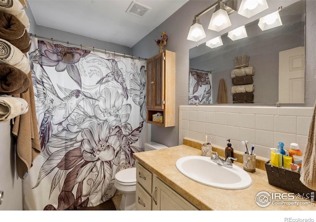 117 Welch Ave, Berthoud, CO 80513 - full bath with toilet, decorative backsplash, vanity, and curtained shower
