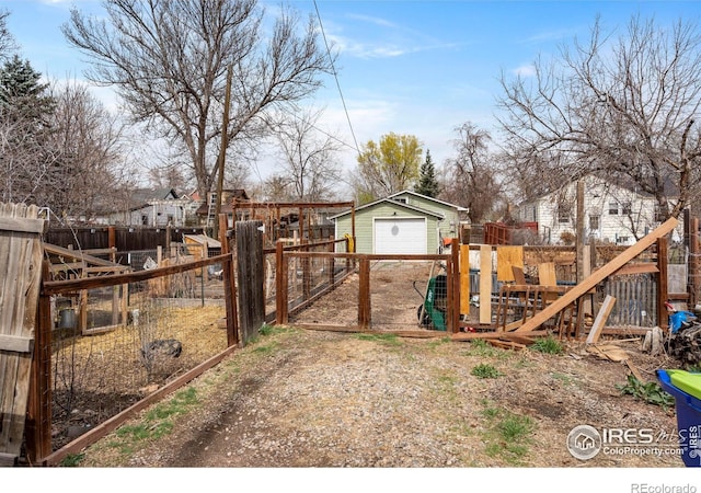 117 Welch Ave, Berthoud, CO 80513 - view of yard with a detached garage and an outdoor structure