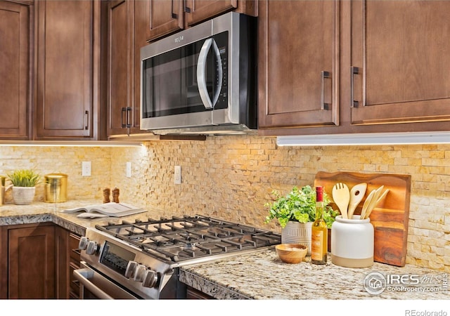 1827 Prairie Ridge Dr, Fort Collins, CO 80526 - kitchen featuring stainless steel appliances and backsplash
