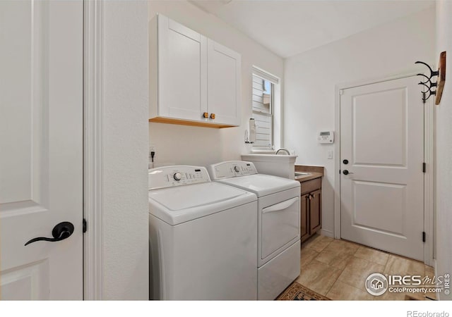 1827 Prairie Ridge Dr, Fort Collins, CO 80526 - laundry area with washer and clothes dryer, cabinet space, and a sink