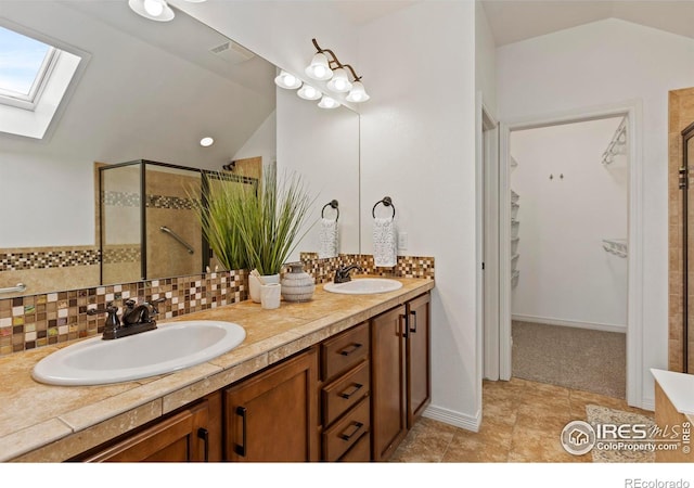 1827 Prairie Ridge Dr, Fort Collins, CO 80526 - full bath with double vanity, a sink, lofted ceiling with skylight, and a shower stall