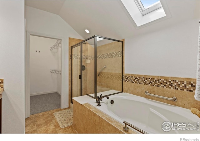 1827 Prairie Ridge Dr, Fort Collins, CO 80526 - full bath with vanity, a spacious closet, lofted ceiling with skylight, a stall shower, and a garden tub