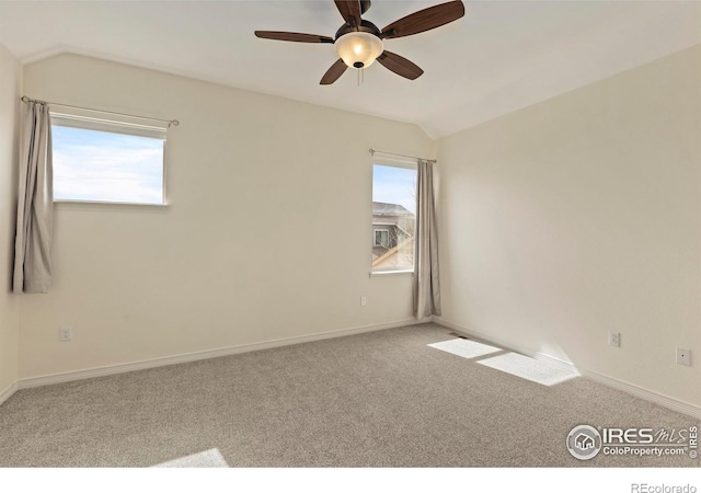 1827 Prairie Ridge Dr, Fort Collins, CO 80526 - spare room with baseboards, lofted ceiling, ceiling fan, and carpet