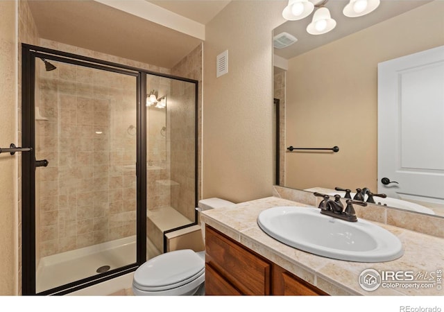 1827 Prairie Ridge Dr, Fort Collins, CO 80526 - bathroom with toilet, visible vents, vanity, and a shower stall