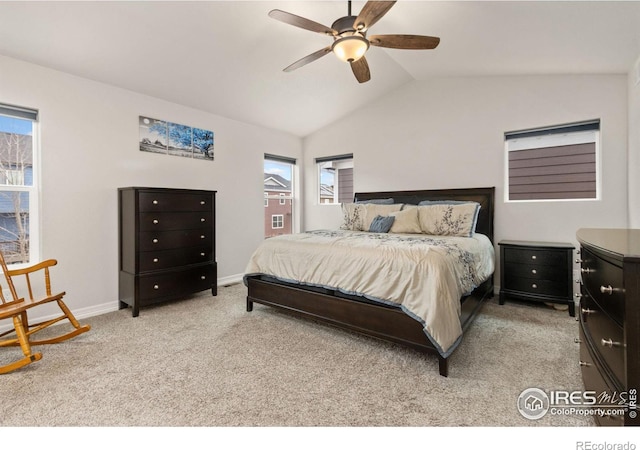bedroom with multiple windows, lofted ceiling, baseboards, and carpet flooring
