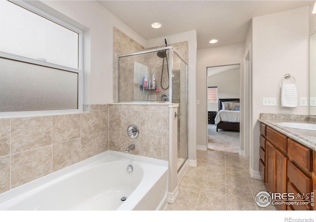 bathroom with vanity, a shower stall, tile patterned floors, ensuite bathroom, and a bath