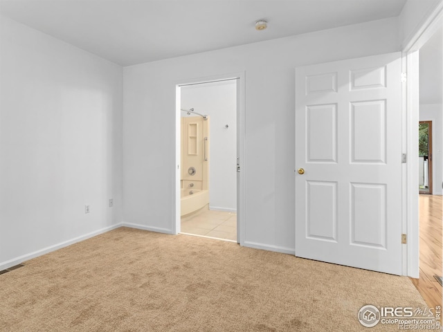 1010 S Saint Vrain Ave S, Estes Park, CO 80517 - unfurnished bedroom with carpet flooring, baseboards, and ensuite bathroom