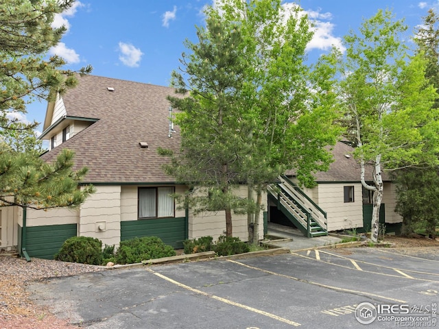 1010 S Saint Vrain Ave S, Estes Park, CO 80517 - view of property with uncovered parking and stairs