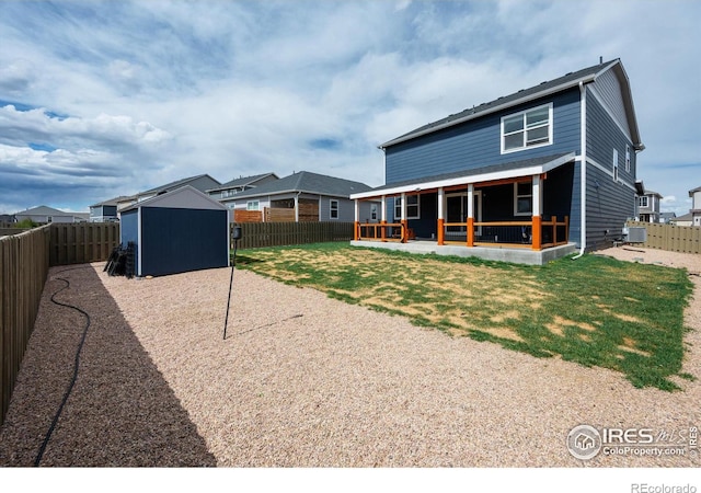 615 Sawyers Pond Dr, Severance, CO 80550 - back of property featuring an outdoor structure, a storage shed, and a patio