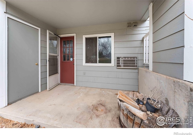 1640 Kirkwood Dr Unit 2011, Fort Collins, CO 80526 - doorway to property featuring an AC wall unit and a patio