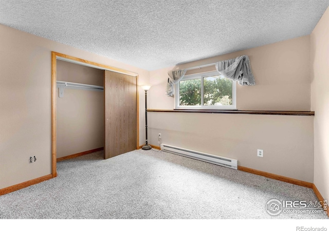 1640 Kirkwood Dr Unit 2011, Fort Collins, CO 80526 - unfurnished bedroom with baseboards, a closet, a baseboard heating unit, and a textured ceiling