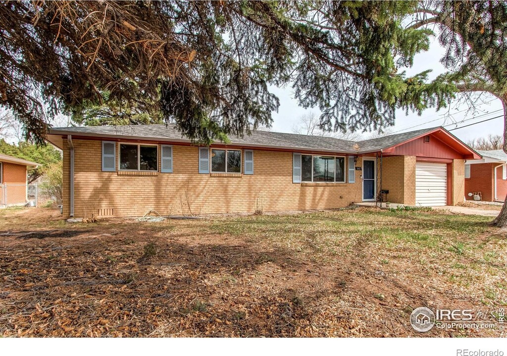 312 Buckley Dr, Longmont, CO 80501 - ranch-style house featuring brick siding and an attached garage