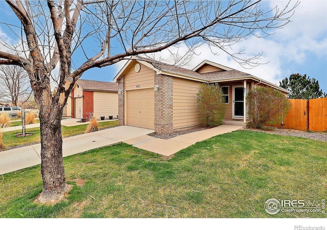 view of front of house with driveway, a front yard, brick siding, a garage, and fence