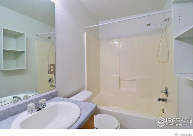 bathroom with vanity,  shower combination, and toilet
