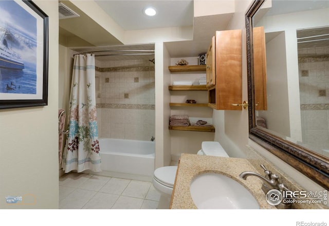 bathroom featuring toilet, shower / bath combination with curtain, tile patterned flooring, and vanity