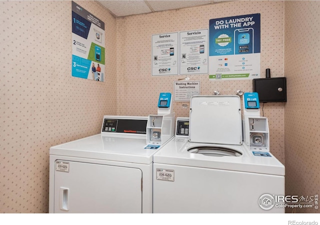 1315 Kirkwood Dr Unit 804, Fort Collins, CO 80525 - common laundry area with washer and clothes dryer and wallpapered walls