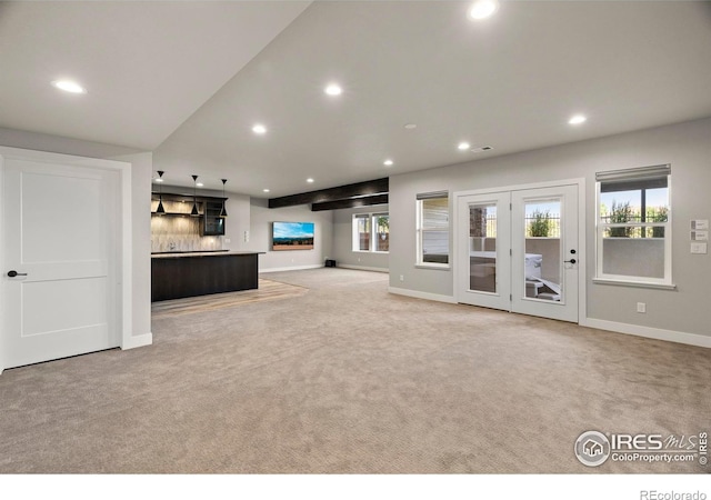 5977 Crooked Stick Dr, Windsor, CO 80550 - unfurnished living room with light carpet and recessed lighting