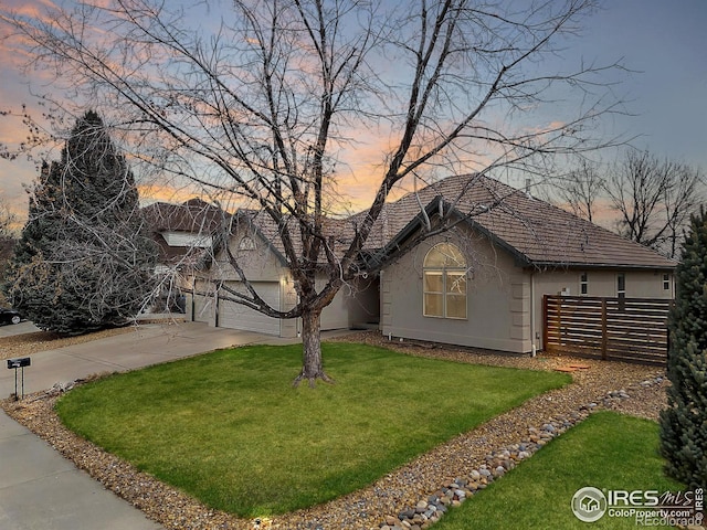 1730 Crestone Dr, Longmont, CO 80504 - ranch-style house with concrete driveway, stucco siding, a garage, and a tile roof