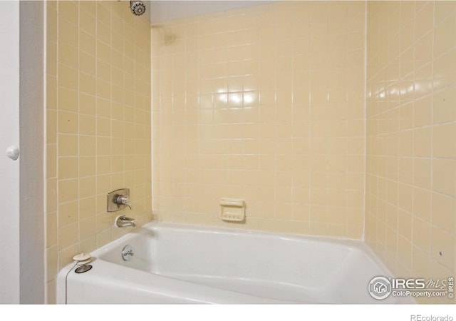 bathroom with shower / bathing tub combination