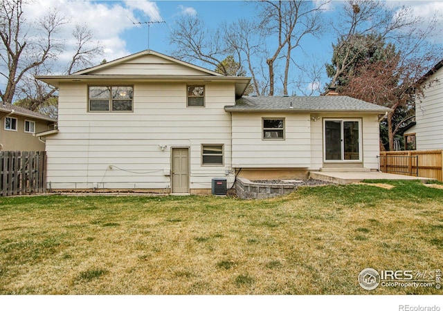 back of house featuring a patio, fence, cooling unit, and a yard