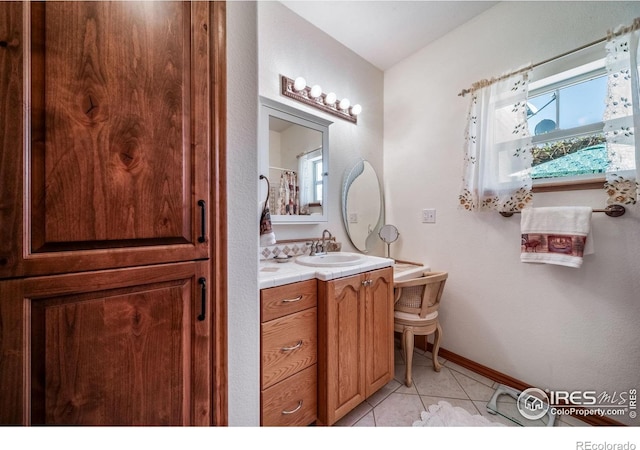 4514 Hoot Owl Dr, Berthoud, CO 80513 - bathroom with tile patterned flooring, vanity, and baseboards