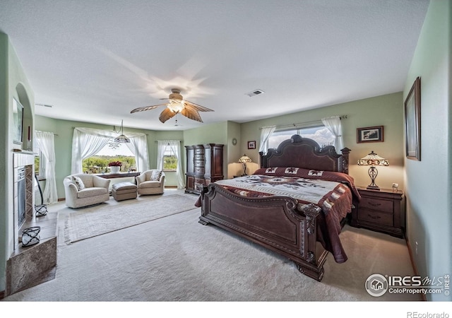 4514 Hoot Owl Dr, Berthoud, CO 80513 - bedroom with carpet flooring, ceiling fan, and a premium fireplace