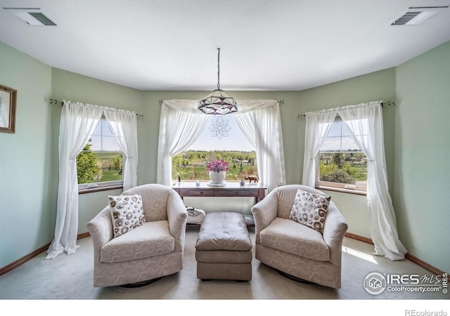 4514 Hoot Owl Dr, Berthoud, CO 80513 - living area with carpet flooring, baseboards, and plenty of natural light