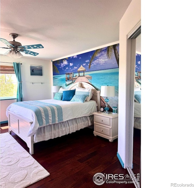 4514 Hoot Owl Dr, Berthoud, CO 80513 - bedroom with wood finished floors, a ceiling fan, and a textured ceiling