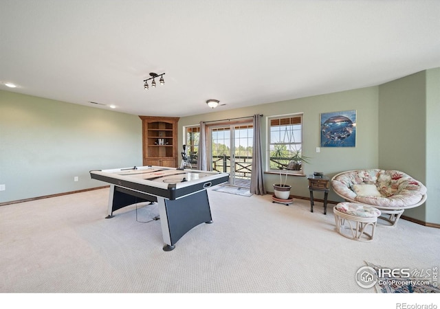 4514 Hoot Owl Dr, Berthoud, CO 80513 - recreation room with light carpet, baseboards, and recessed lighting