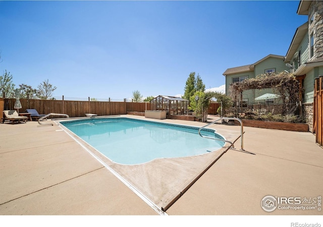 4514 Hoot Owl Dr, Berthoud, CO 80513 - view of pool featuring a patio, a fenced backyard, and a diving board