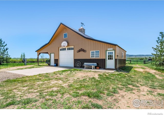 4514 Hoot Owl Dr, Berthoud, CO 80513 - view of outbuilding with fence and driveway