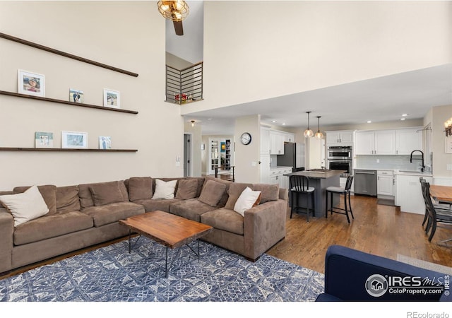 501 W Linden St, Louisville, CO 80027 - living area with dark wood-type flooring and a towering ceiling