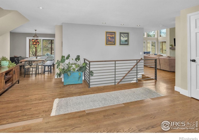 501 W Linden St, Louisville, CO 80027 - interior space with a wealth of natural light, a notable chandelier, wood finished floors, and recessed lighting