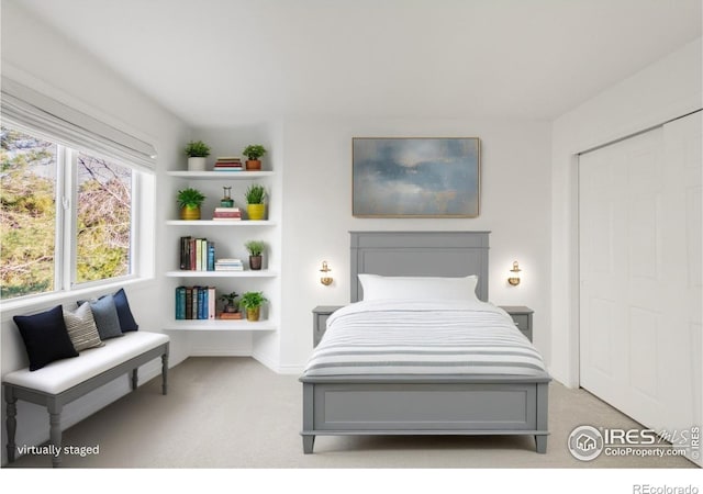 bedroom with light colored carpet