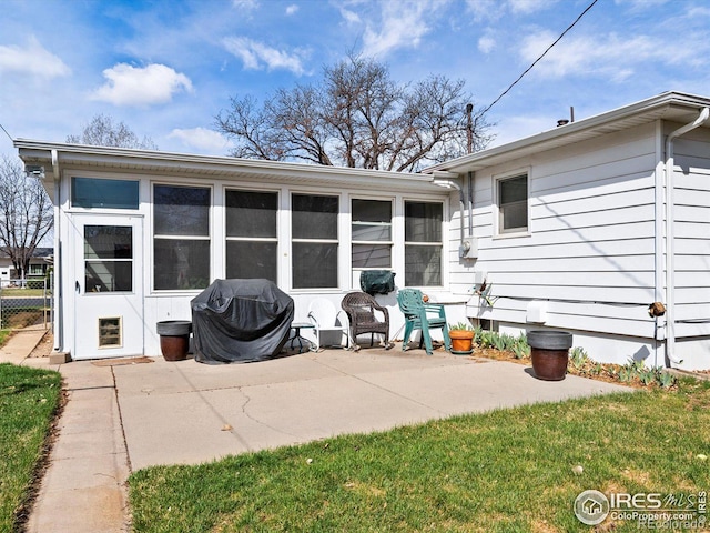 rear view of property featuring a patio area