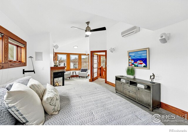 living area with baseboards, a wall mounted AC, ceiling fan, and carpet floors