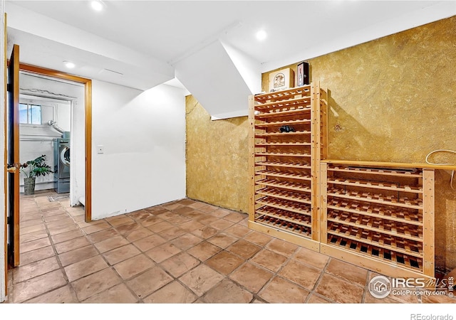wine area with washer / clothes dryer and recessed lighting