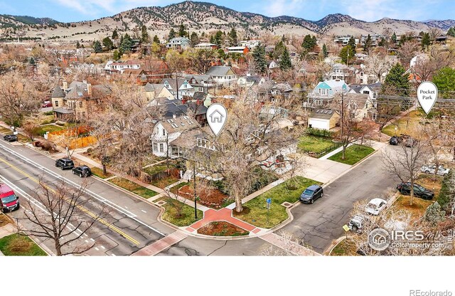 drone / aerial view featuring a mountain view and a residential view