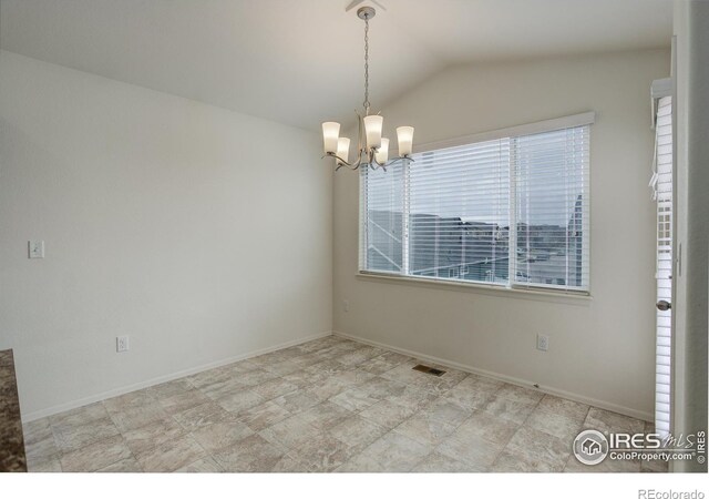 unfurnished room featuring lofted ceiling, baseboards, and an inviting chandelier