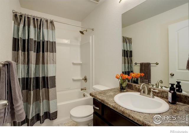 bathroom featuring toilet, vanity, and shower / tub combo with curtain
