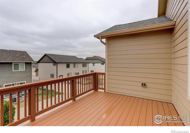 wooden terrace with a residential view