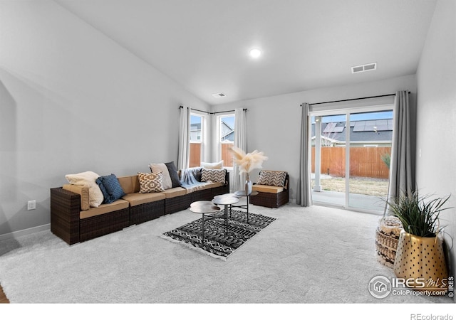 702 S Fulton Ave, Fort Lupton, CO 80621 - carpeted living area with vaulted ceiling and baseboards