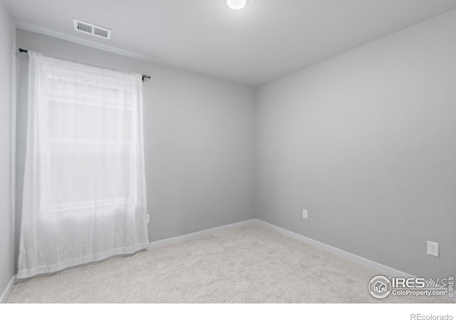 702 S Fulton Ave, Fort Lupton, CO 80621 - carpeted spare room featuring baseboards
