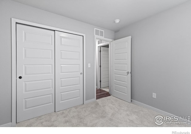 702 S Fulton Ave, Fort Lupton, CO 80621 - unfurnished bedroom featuring carpet and a closet