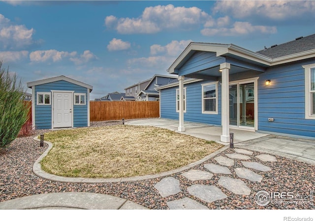 702 S Fulton Ave, Fort Lupton, CO 80621 - view of yard featuring a patio and a storage shed