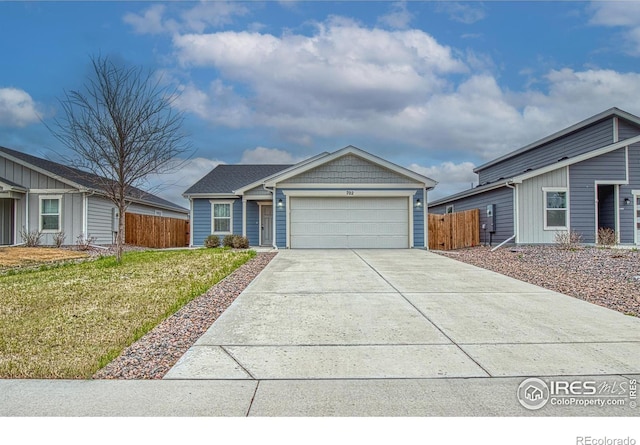 702 S Fulton Ave, Fort Lupton, CO 80621 - ranch-style house featuring an attached garage and concrete driveway